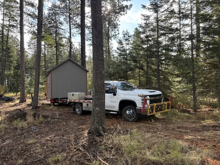 Shed arriving on a flatbed delivery truck