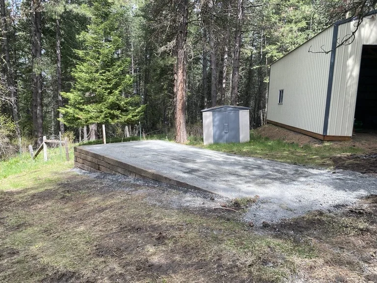 Wide-body delivery truck carrying a custom shed