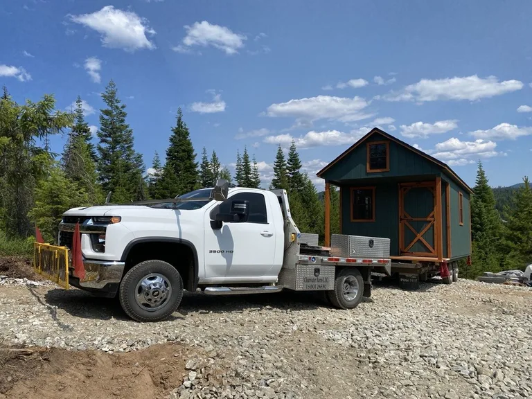 Shed pad site preparation with compacted gravel base