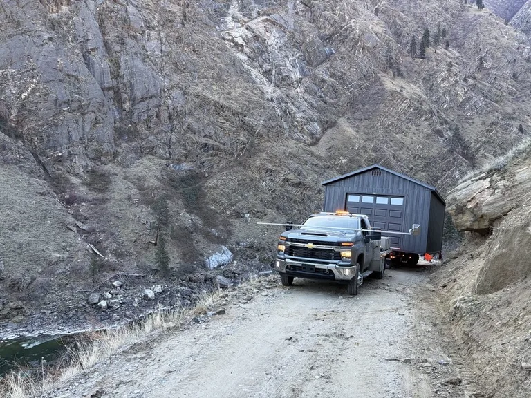 Storage building set onto a level gravel pad