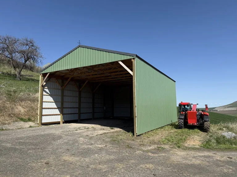 Building finished with metal roofing and siding panels
